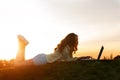 Girl with computer in nature. Royalty Free Stock Photo