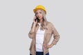 Girl Construction Worker Seriously Talking on Phone Watching Front Isolated. Girl Working. Modern Construction