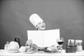 Girl cook at kitchen table ingredients. Tips and advice. Preparing food. Delicious and gourmet. Cooking food as hobby