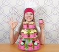 Girl cook with muffins dessert and ok hand sign Royalty Free Stock Photo