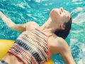 Girl cooling down in a swimming pool Royalty Free Stock Photo