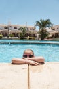 Girl cooling of in a pool Royalty Free Stock Photo