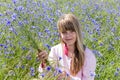 Girl in cornflower field
