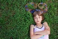 Girl with cornflowers in her hair and folded arms