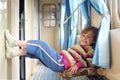 Girl in corridor of railway car