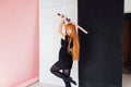 Girl cosplayer with red hair anime japan sword Royalty Free Stock Photo