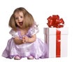 Girl in costume of doll with gift box. Royalty Free Stock Photo