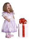 Girl in costume of doll with gift box. Royalty Free Stock Photo