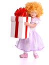 Girl in costume of doll with gift box. Royalty Free Stock Photo