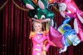 Girl in Costume Holding Bunch of Balloons on Stage Royalty Free Stock Photo