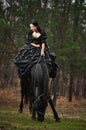 Girl in costume on horseback