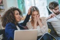 Girl covering her face with her hands and friend calming her Royalty Free Stock Photo