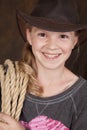 Girl cowboy hat rope smile close Royalty Free Stock Photo