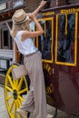 Embrace the Wild West: Woman on a Cowboy Wooden Wagon in El Paso Royalty Free Stock Photo