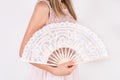 Elegance in Motion: Fashion Model with White Lace Folding Hand Fan