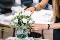 Girl creates a floral arrangement