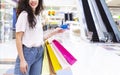 Girl with credit card making purchases in shopping center Royalty Free Stock Photo