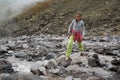 Girl is crossing mountain river