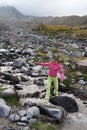 Girl is crossing mountain river