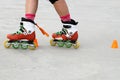 Girl crossing skates while skating Royalty Free Stock Photo