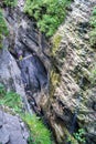 Girl crossing a suspended wooden bridge at Postalm gorge.