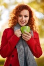 Girl with cup of coffee in autumn Royalty Free Stock Photo