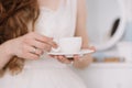 Girl with a cup of coffee. Romantic breakfast. Morning of the bride. Concept of holiday, birthday, Easter, March 8