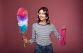 A girl in curlers and gloves for cleaning holds pipidaster in her hands