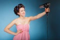 Girl with curlers in hair holds hairdreyer Royalty Free Stock Photo