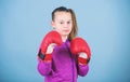 Girl cute boxer on blue background. With great power comes great responsibility. Contrary to stereotype. Boxer child in