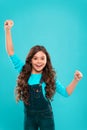Girl cute child long curly hair happy smiling. Child psychology and development. Happy winner. Celebrate victory or Royalty Free Stock Photo
