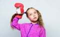 Girl cute child with red gloves posing on white background. Sport upbringing for leader. Cute kid with sport boxing Royalty Free Stock Photo