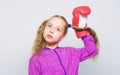 Girl cute child with red gloves posing on white background. Sport upbringing for leader. Cute kid with sport boxing Royalty Free Stock Photo