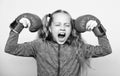 Girl cute child with red gloves posing on white background. Upbringing for leader. Strong child boxing. Sport and health