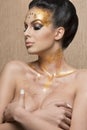 Girl with cute golden make-up Royalty Free Stock Photo