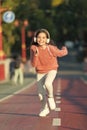 Girl cute with headphones. Little child enjoy activity. Kid walking running in park listening music. Music fills me with Royalty Free Stock Photo