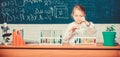 Girl cute pupil play with test tubes and colorful liquids. School chemical experiment. School education. Interesting Royalty Free Stock Photo