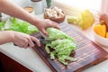 Girl cuts Chinese cabbage