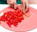 Girl cuts a tomato knife Royalty Free Stock Photo