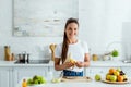 Girl cutting banana on peeling board near tasty fruits Royalty Free Stock Photo