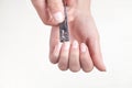 Girl cutting fingernails using a nail clipper Royalty Free Stock Photo