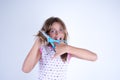 Girl cutting her hair with scissors Royalty Free Stock Photo