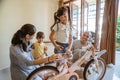 Girl cutting plastic wrap while holding new mini bike