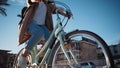 Girl is cycling in promenade