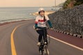 The girl cycling uphill on the road. Royalty Free Stock Photo