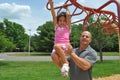 Girl and Dad in a playground Royalty Free Stock Photo