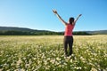 Girl in daisy wheel spring flower field