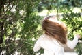 Girl dancer with long flying hair. Kid dance to music in summer park. Small child enjoy music in headphones outdoor Royalty Free Stock Photo