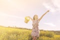 Girl dancing among flowers in a sunny day Royalty Free Stock Photo