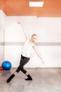 The girl is dancing in the gym. The concept of sport, dance and Royalty Free Stock Photo